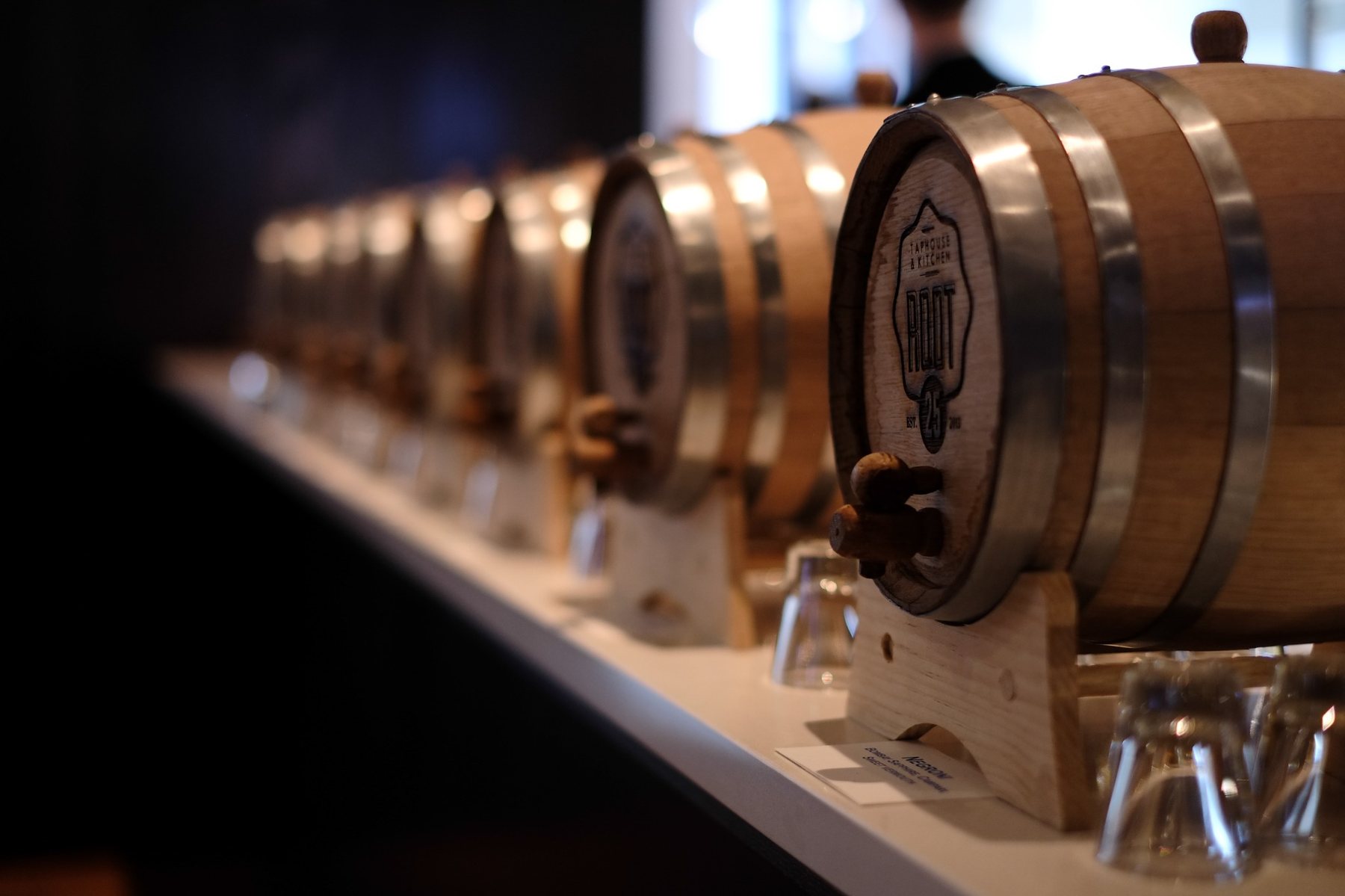 Beverage concept detail with branded service barrels
